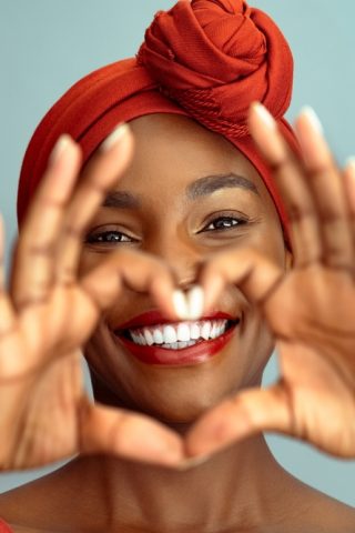 Close,Up,Of,Hands,Of,Beautiful,African,Woman,Making,Heart